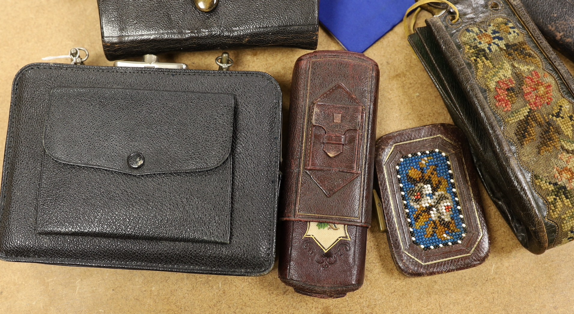 A large collection of unusual Morocco leather purses, bags and containers, some embossed and some with petite point embroidery, mostly 19th century.